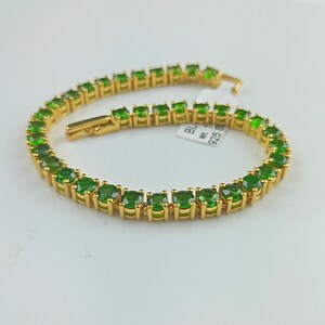 This beautiful tennis bracelet is handmade of 925 sterling silver, gold plated, and studded with prong set round cut chrome diopside gemstone. best gift for women and girls.
Chrome Diopside Bracelet
Tennis Bracelet
Handmade Bracelet
14K Gold Bracelet