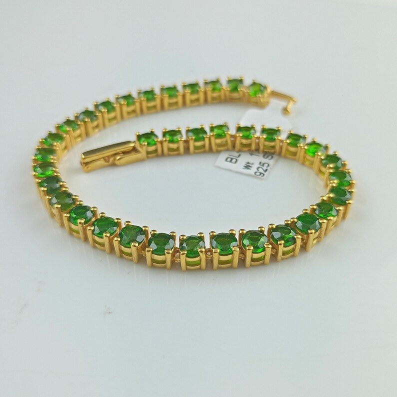 This beautiful tennis bracelet is handmade of 925 sterling silver, gold plated, and studded with prong set round cut chrome diopside gemstone. best gift for women and girls.
Chrome Diopside Bracelet
Tennis Bracelet
Handmade Bracelet
14K Gold Bracelet