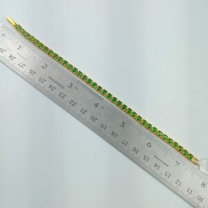 This beautiful tennis bracelet is handmade of 925 sterling silver, gold plated, and studded with prong set round cut chrome diopside gemstone. best gift for women and girls.
Chrome Diopside Bracelet
Tennis Bracelet
Handmade Bracelet
14K Gold Bracelet