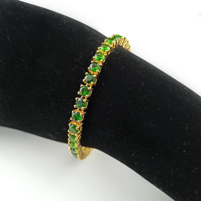 This beautiful tennis bracelet is handmade of 925 sterling silver, gold plated, and studded with prong set round cut chrome diopside gemstone. best gift for women and girls.
Chrome Diopside Bracelet
Tennis Bracelet
Handmade Bracelet
14K Gold Bracelet