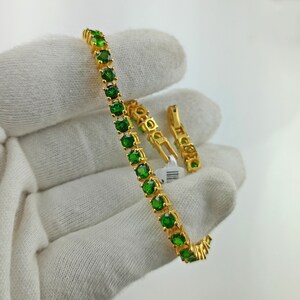 This beautiful tennis bracelet is handmade of 925 sterling silver, gold plated, and studded with prong set round cut chrome diopside gemstone. best gift for women and girls.
Chrome Diopside Bracelet
Tennis Bracelet
Handmade Bracelet
14K Gold Bracelet