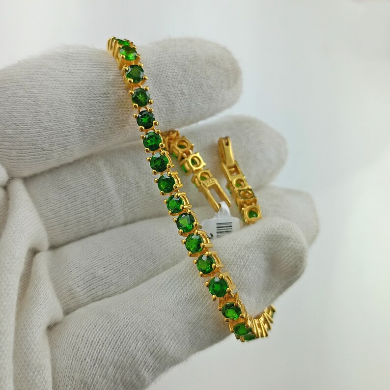 This beautiful tennis bracelet is handmade of 925 sterling silver, gold plated, and studded with prong set round cut chrome diopside gemstone. best gift for women and girls.
Chrome Diopside Bracelet
Tennis Bracelet
Handmade Bracelet
14K Gold Bracelet