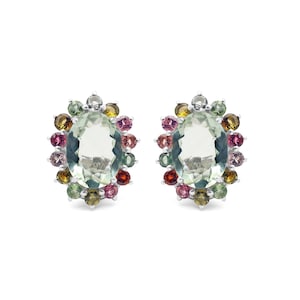 May include: A pair of silver earrings with a green oval gemstone surrounded by a halo of colorful gemstones.