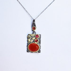 This beautiful boho pendant handmade of 925 sterling silver black rhodium gold plated and studded with natural carnelian gemstone. Best jewelry gift for women and girls.