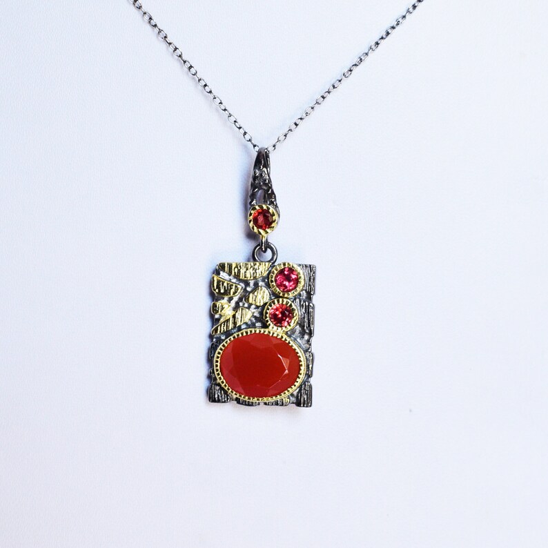 This beautiful boho pendant handmade of 925 sterling silver black rhodium gold plated and studded with natural carnelian gemstone. Best jewelry gift for women and girls.