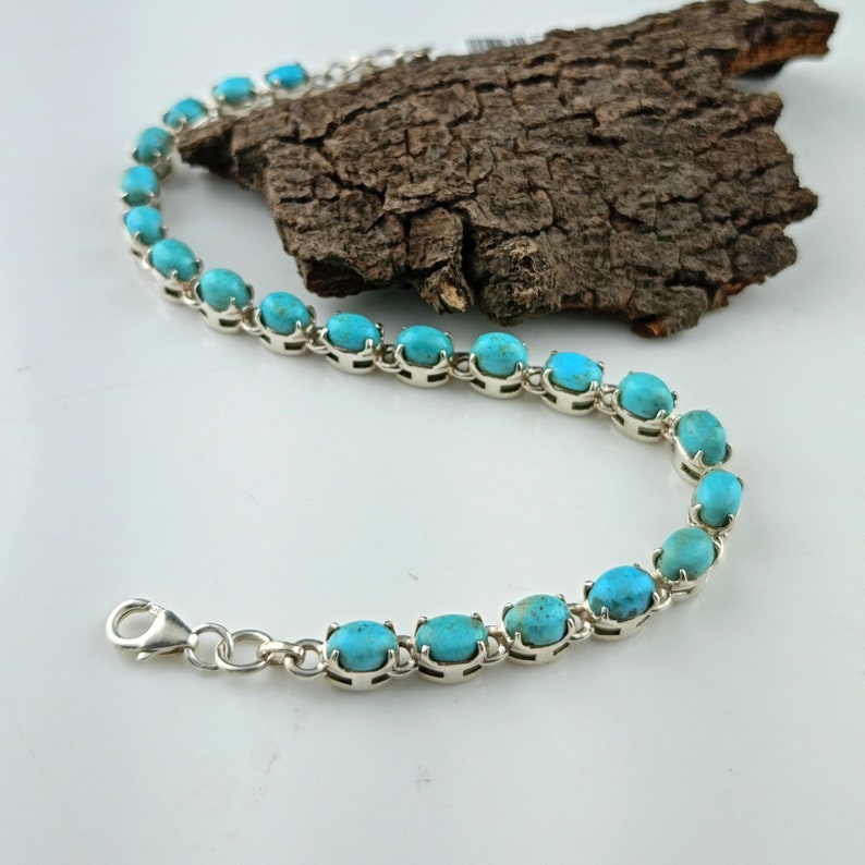 This beautiful tennis bracelet handmade of 925 sterling silver studded with prong set oval turquoise cabochon gemstone best gift for women and girls.
Turquoise Bracelet
Natural Turquoise
Kingman Turquoise
925 Silver Bracelet
Bracelet for Her