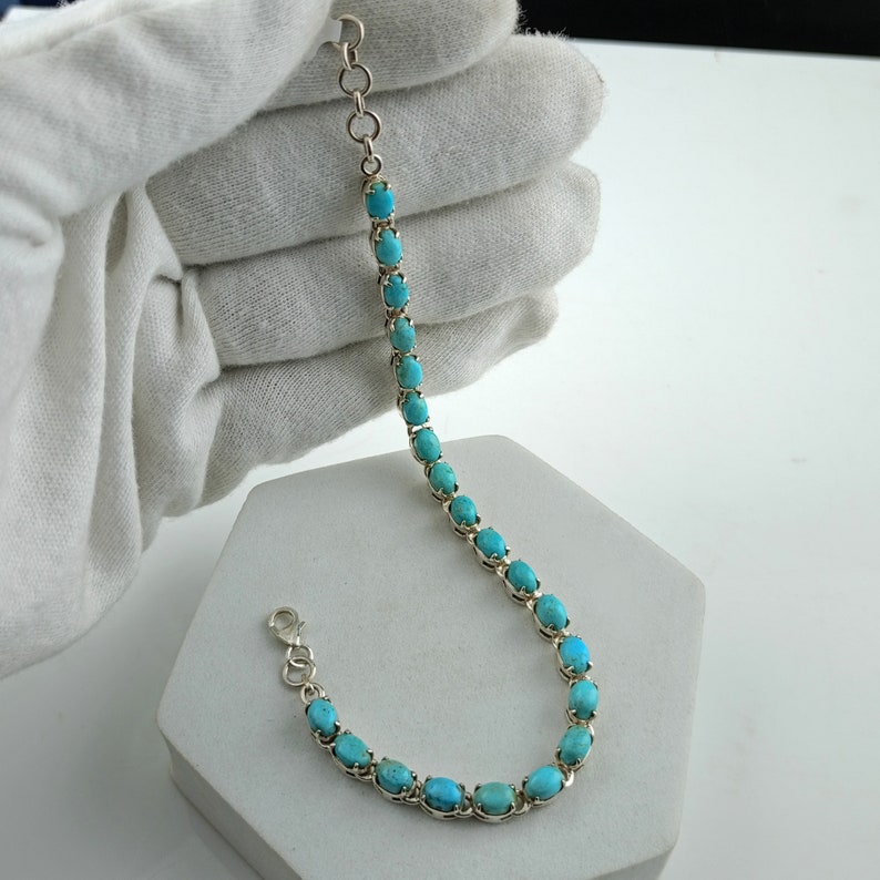 This beautiful tennis bracelet handmade of 925 sterling silver studded with prong set oval turquoise cabochon gemstone best gift for women and girls.