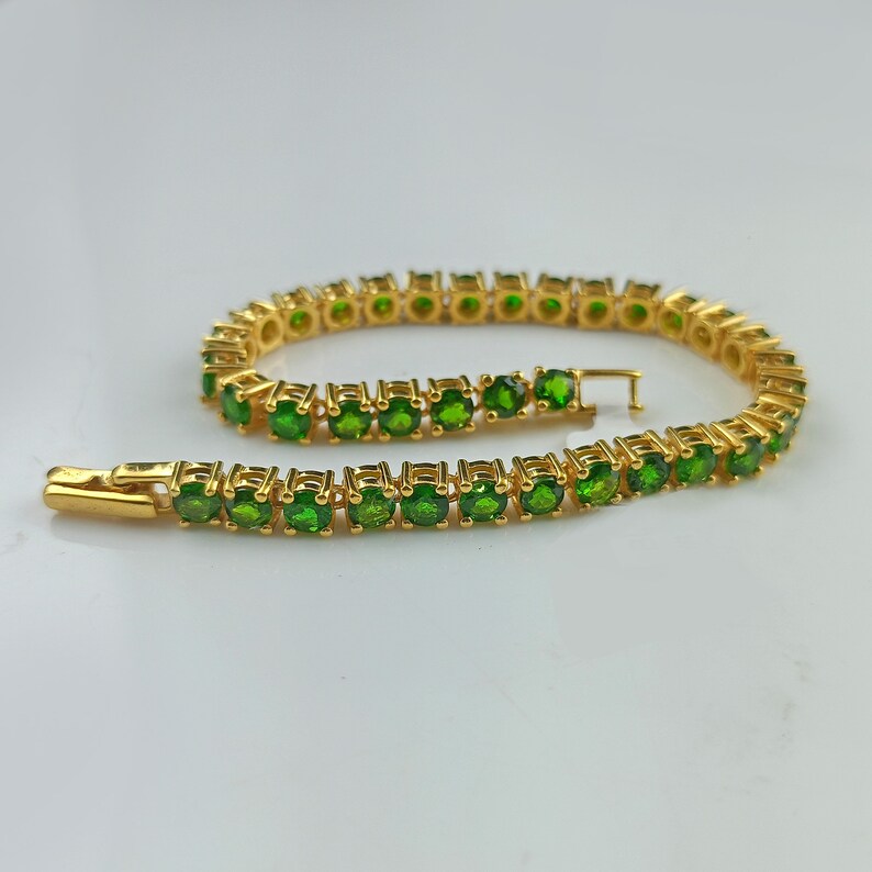 This beautiful tennis bracelet is handmade of 925 sterling silver, gold plated, and studded with prong set round cut chrome diopside gemstone. best gift for women and girls.
Chrome Diopside Bracelet
Tennis Bracelet
Handmade Bracelet
14K Gold Bracelet