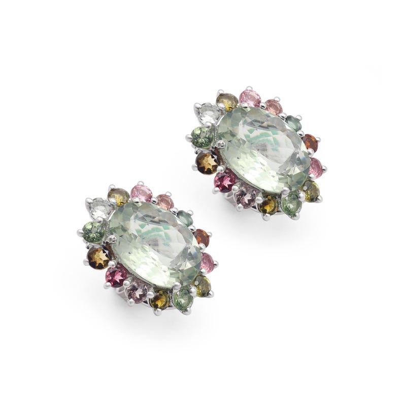 May include: A pair of silver earrings with a large oval green gemstone surrounded by a halo of smaller multi-colored gemstones.