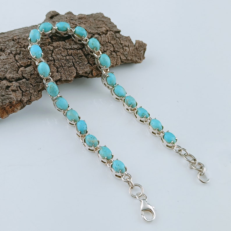 This beautiful tennis bracelet handmade of 925 sterling silver studded with prong set oval turquoise cabochon gemstone best gift for women and girls.