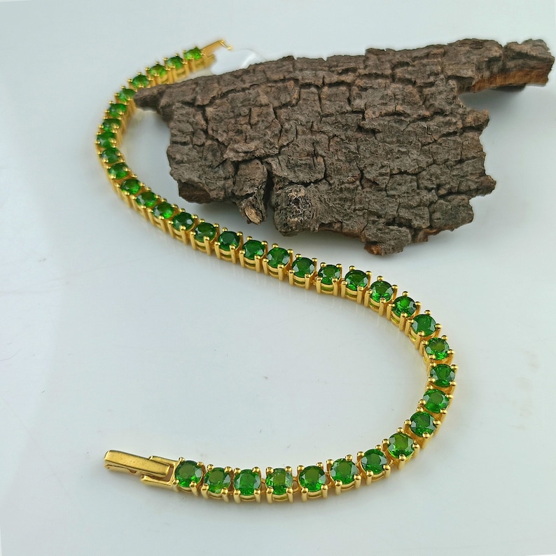 This beautiful tennis bracelet is handmade of 925 sterling silver, gold plated, and studded with prong set round cut chrome diopside gemstone. best gift for women and girls.
Chrome Diopside Bracelet
Tennis Bracelet
Handmade Bracelet
14K Gold Bracelet