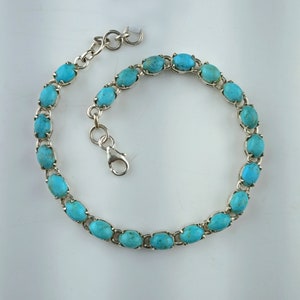 This beautiful tennis bracelet handmade of 925 sterling silver studded with prong set oval turquoise cabochon gemstone best gift for women and girls.