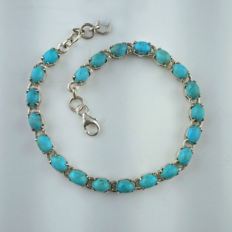 This beautiful tennis bracelet handmade of 925 sterling silver studded with prong set oval turquoise cabochon gemstone best gift for women and girls.