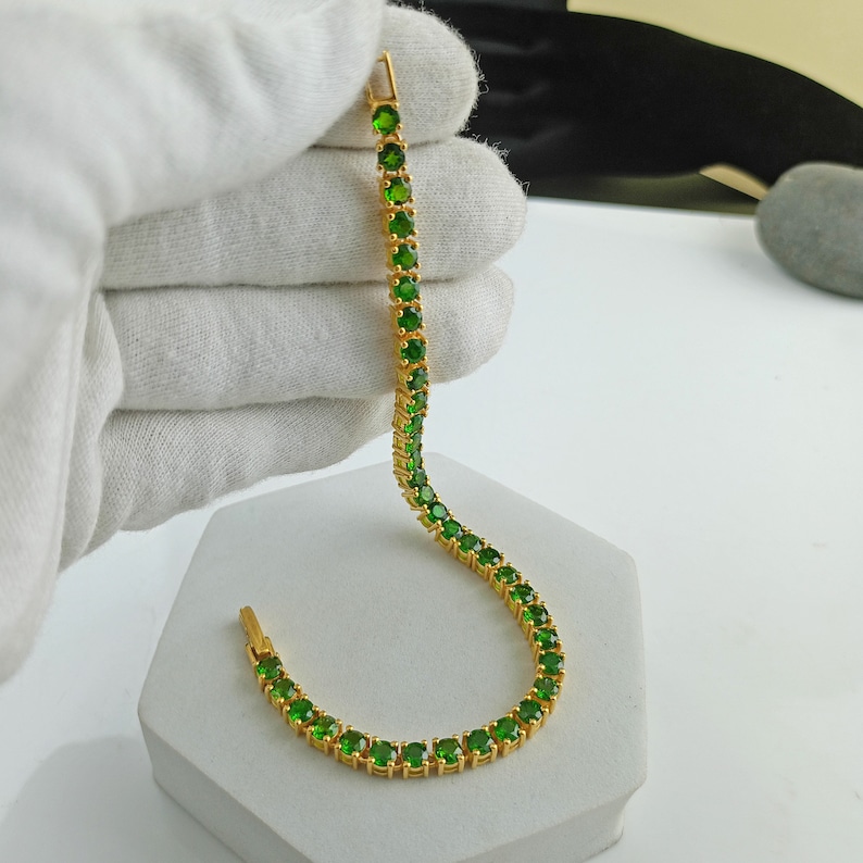 This beautiful tennis bracelet is handmade of 925 sterling silver, gold plated, and studded with prong set round cut chrome diopside gemstone. best gift for women and girls.
Chrome Diopside Bracelet
Tennis Bracelet
Handmade Bracelet
14K Gold Bracelet