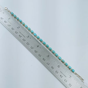 This beautiful tennis bracelet handmade of 925 sterling silver studded with prong set oval turquoise cabochon gemstone best gift for women and girls.