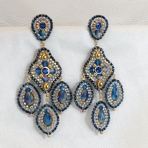 Earrings with three teal blue crystal drops, hand-woven statement earrings with k24 gold-plated Miyuki beads and Swarovski Elements