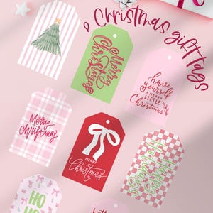 May include: A collection of Christmas gift tags in various designs and colors. Some tags feature text like "Merry Christmas" and "Happy Holidays." Other tags have images of a Christmas tree, bows, and Santa Claus. The tags are on a pink background.