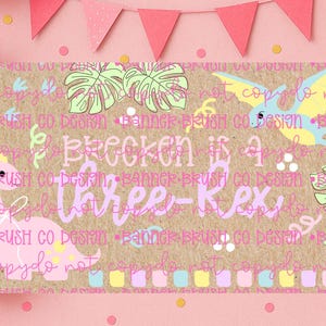 May include: A birthday banner with a pink and brown theme. The banner features a dinosaur illustration, tropical leaves, and the text "Brecken is a Three-Rex". Pink balloons and a pink banner are in the background.