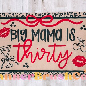May include: Tan doormat with a black border and leopard print trim. The mat features the text "BIG MAMA IS thirty" in black and red, along with illustrations of lips, cherries, and a cocktail glass.