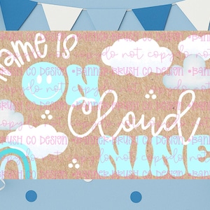 May include: A kraft paper design with the words "Name is on Cloud Nine" in a whimsical font, along with cloud and rainbow illustrations. The design includes a smiley face and is decorated with blue balloons and bunting.