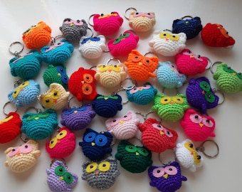 Hand crocheted owl keyrings with felt eyes in a variety of customisable colours