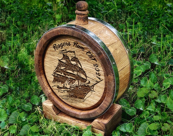 A miniature engraved whiskey barrel shaped like a pirate ship — wildly specific, visually arresting, and the kind of thing that stops a scroll dead.