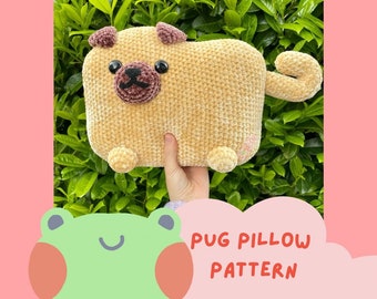 May include: A crocheted pug pillow pattern. The pillow is tan with brown eyes and a black nose. The pillow is sitting on a bed of green leaves.