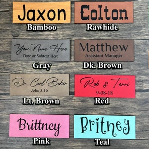 May include: Ten leather labels in different colors with names and text printed on them. The colors are bamboo, rawhide, gray, dark brown, light brown, red, pink, and teal.