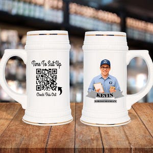 May include: White ceramic beer stein with a handle and gold trim. One stein features a QR code and the text "Time To Suit Up" and "Check This Out". The other stein has a photo of a man in a postal worker uniform and the name "Kevin, Groomsman".