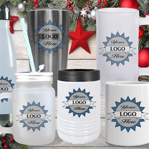 May include: A white ceramic mug with a black handle and the text "But First, Coffee" in a bold, black font. The mug is set against a neutral background, highlighting its simple design.