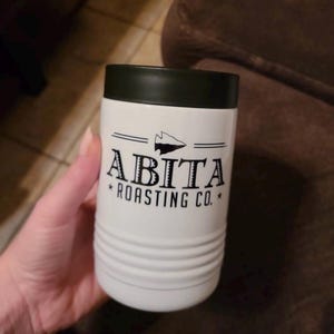 May include: A set of three ceramic mugs with a speckled, matte finish. Each mug features a different color: light blue, cream, and gray. The mugs have a simple, modern design, perfect for coffee or tea.