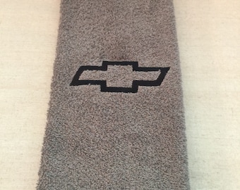 May include: Gray hand towel with a black embroidered Chevrolet logo.