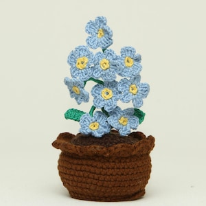 May include: A set of three ceramic mugs with a speckled, matte finish. The mugs are in shades of cream, light gray, and dark gray. Each mug has a simple, minimalist design and a rounded handle.