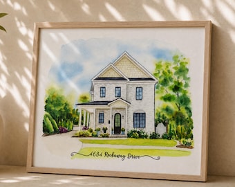 May include: A watercolor painting of a two-story house with a front porch, light-colored siding, and dark window frames. The text 4634 Rockaway Drive is written in black cursive script at the bottom of the house illustration inside a wooden frame.