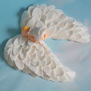 Cake decoration angel wings with baby baptismFondant cake decoration fondant fondant figures fondant figures