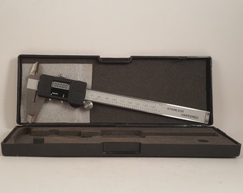 Vintage Electronic Caliper...mm/inch...Has data output port...Scale on rear...Works great in original case with instructions
