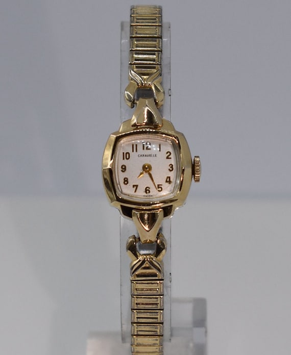 Caravelle 10k rgp store bezel stainless steel back