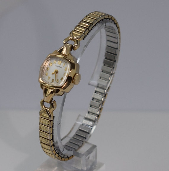 Caravelle 10k rgp store bezel stainless steel back