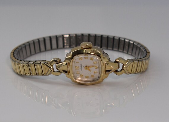Caravelle 10k rgp deals bezel stainless steel back