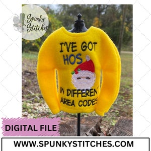May include: A yellow felt Christmas sweater with the text "I'VE GOT HOS" above a Santa Claus face and the text "IN DIFFERENT AREA CODES". The sweater is displayed on a black mannequin. The image also includes the text "DIGITAL FILE" and "WWW.SPUNKYSTITCHES.COM".