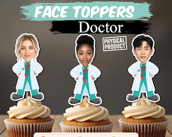 May include: Three cupcake toppers featuring cartoon-style doctor bodies with realistic human faces, wearing white lab coats over teal scrubs with red stethoscopes. The text reads FACE TOPPERS Doctor and PHYSICAL PRODUCT, with icons for photo, assembly, and shipping.