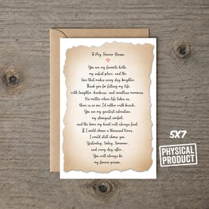 May include: A 5x7 physical greeting card with a tan, deckled-edge paper overlay featuring black printed text that reads: To My Forever Person, You are my favorite hello, my safest place, and the love that makes every day brighter.