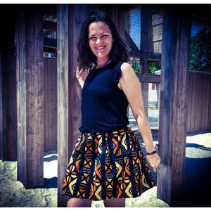 Pleated skirt in wax cotton, very good quality, geometric patterns and warm colors