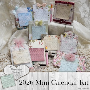 May include: A selection of 2026 mini calendar kits, showcasing floral and butterfly patterns. Each calendar displays the month of January, with decorative elements such as bows and embellishments. The text "2026 Mini Calendar Kit" is visible on the image.