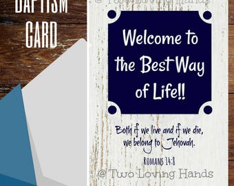 May include: Baptism card with a navy blue and white design. The card reads "Welcome to the Best Way of Life!!" and includes a Bible verse. An envelope is partially visible in the image.