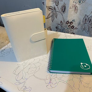 White Organizer and Green Panda Planner