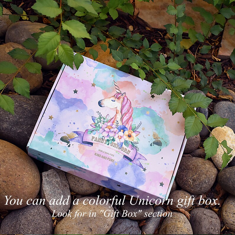 May include: A colourful gift box with a watercolour design of a unicorn and stars. The box says "Fairy Unicorn" and "Noble Qualities Kind and Pure".