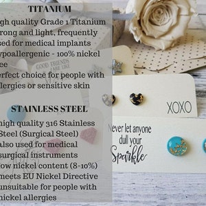 May include: Comparison chart of titanium and stainless steel earrings. Titanium earrings are hypoallergenic and nickel-free. Stainless steel earrings are made with surgical steel and have a low nickel content. The chart includes the text "Never let anyone dull your sparkle" and "XOXO".