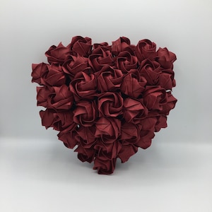Heart created with 36 origami roses