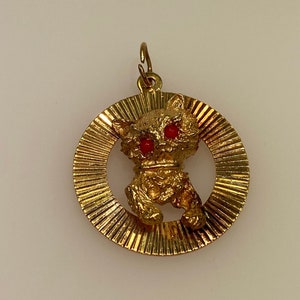 Vintage 14k yellow gold cat with orange cat’s eyes charm
